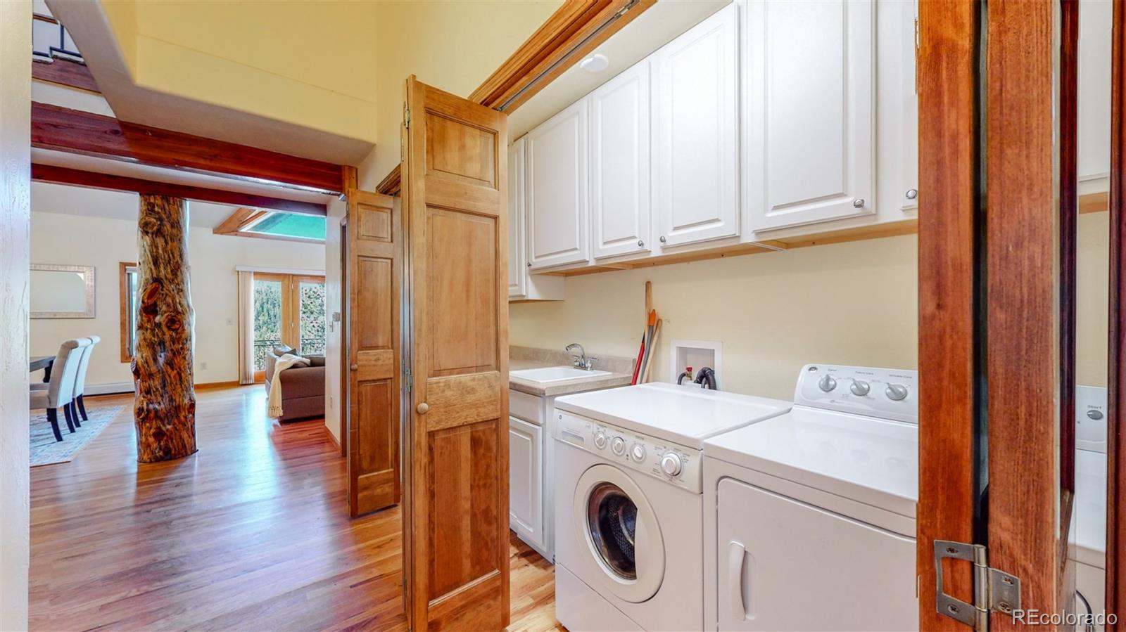 153 Ski Road East Allenspark, CO 80510 - Photo 39 of 40 a utility room with dryer and washer