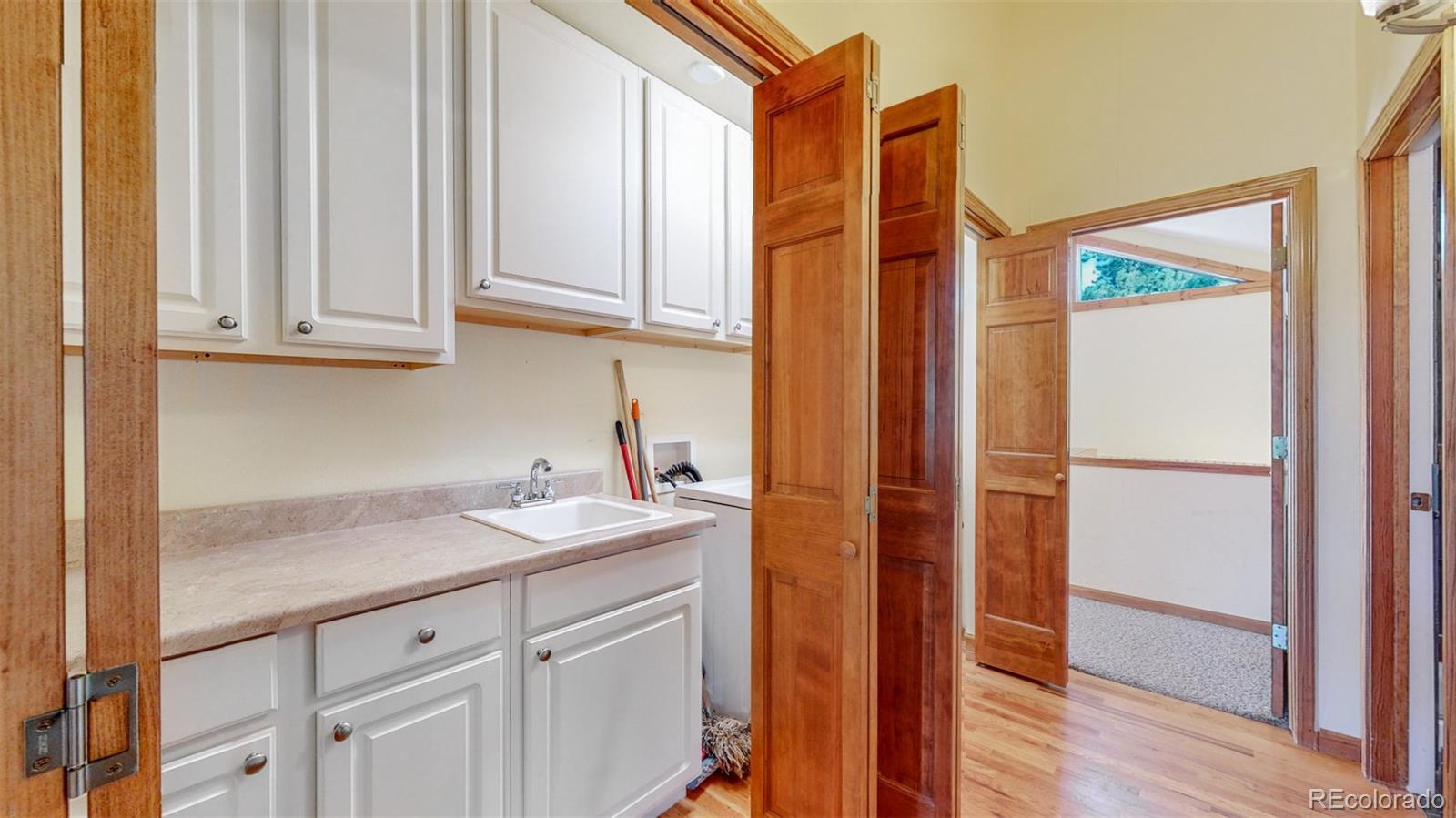 153 Ski Road East Allenspark, CO 80510 - Photo 40 of 40 a bathroom with a sink and a mirror