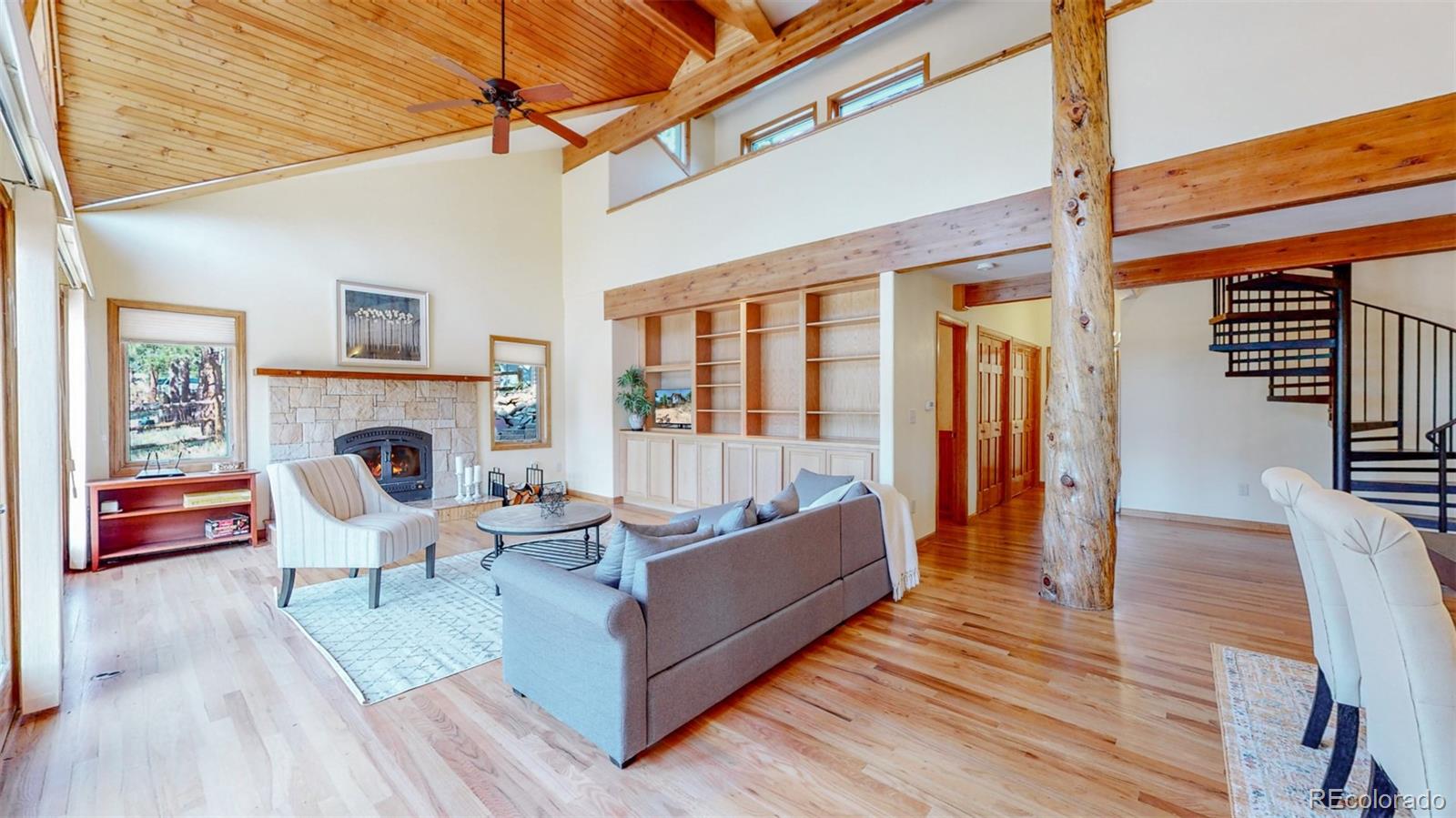 153 Ski Road East Allenspark, CO 80510 - Photo 4 of 40 a living room with furniture and a fireplace