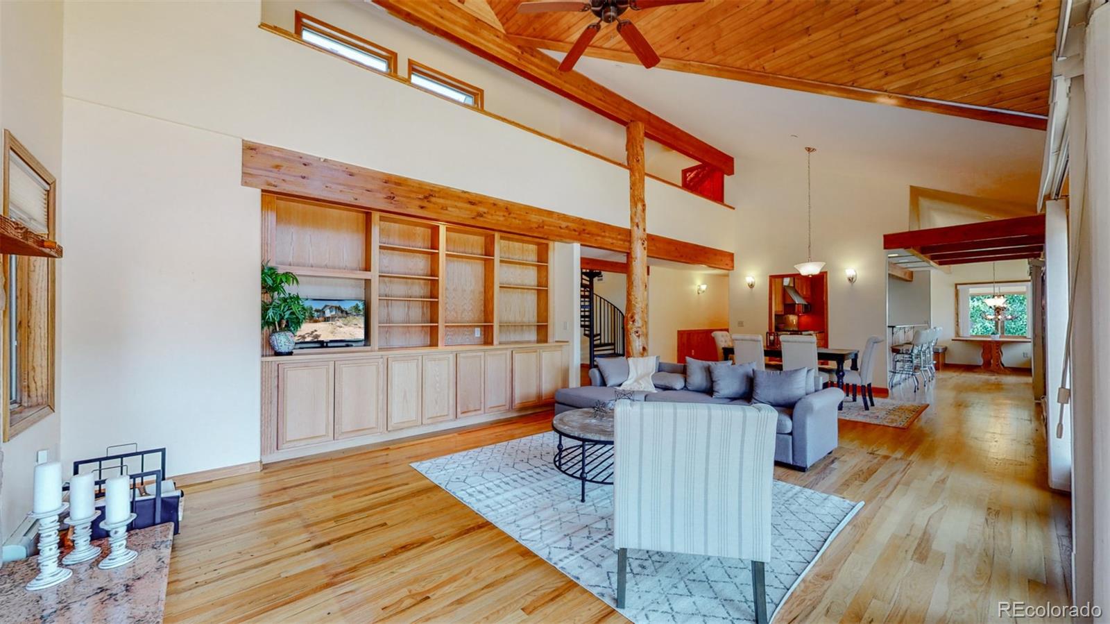 153 Ski Road East Allenspark, CO 80510 - Photo 8 of 40 a living room with furniture and a wooden floor