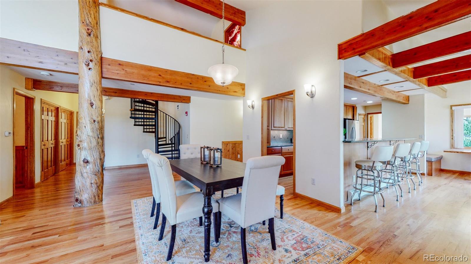 153 Ski Road East Allenspark, CO 80510 - Photo 10 of 40 a dining room with furniture and wooden floor