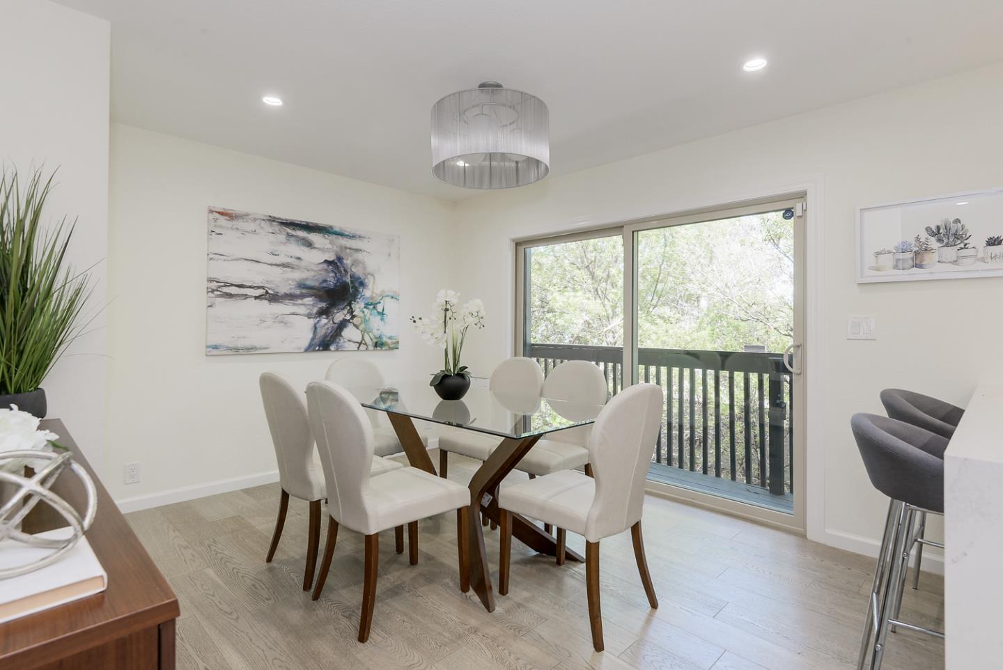 33 Park Road, Unit 10 Burlingame, CA 94010 - Photo 12 of 41 a view of a dining room with furniture window and outside view