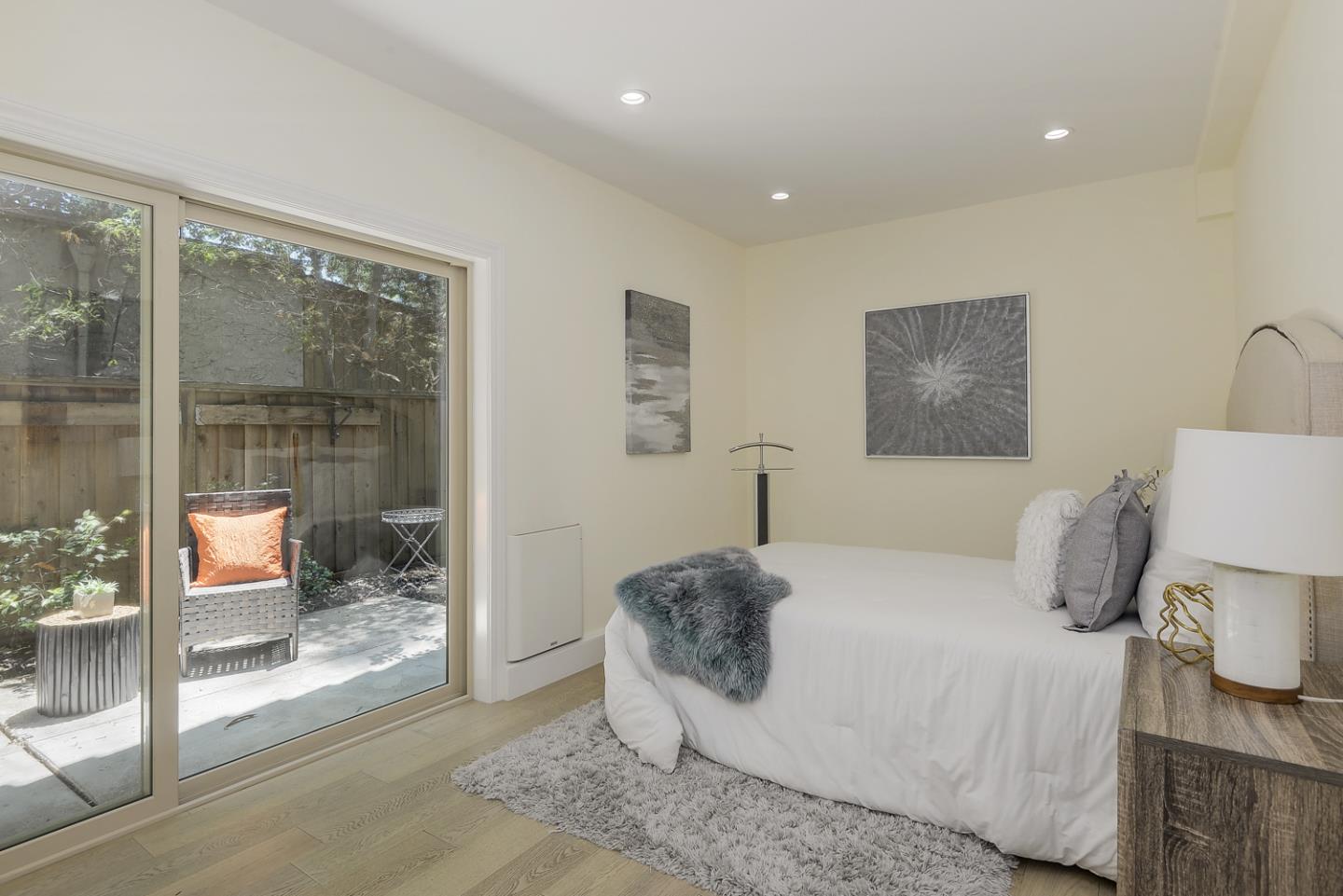 33 Park Road, Unit 10 Burlingame, CA 94010 - Photo 21 of 41 a bedroom with a bed and glass door