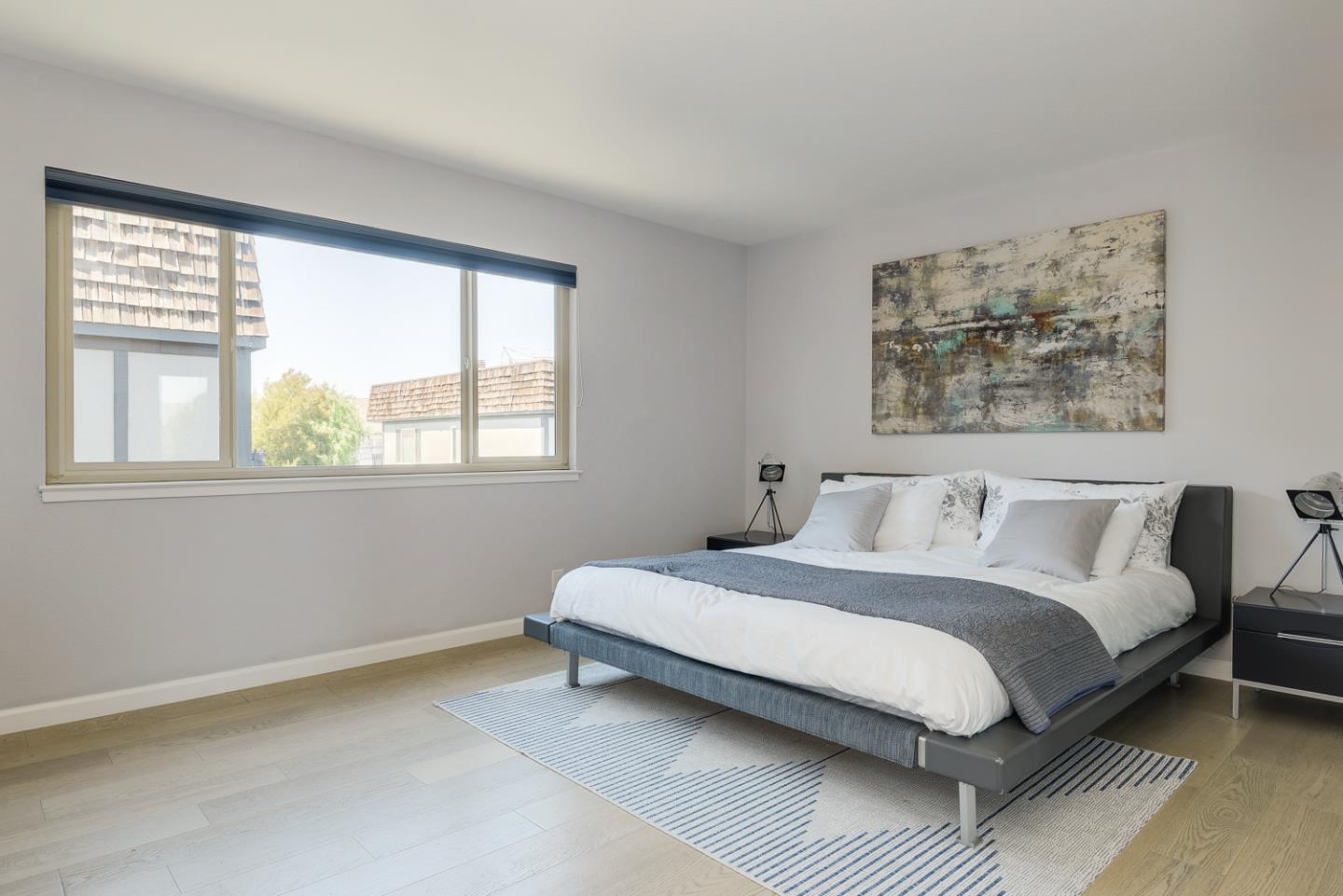 33 Park Road, Unit 10 Burlingame, CA 94010 - Photo 23 of 41 a bedroom with a bed and a window