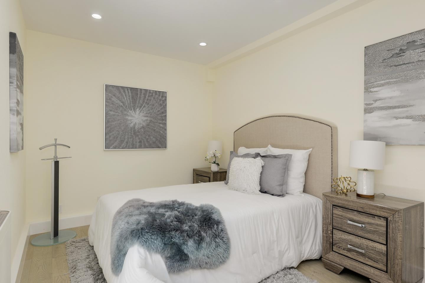 33 Park Road, Unit 10 Burlingame, CA 94010 - Photo 29 of 41 a bedroom with a bed and a lamp
