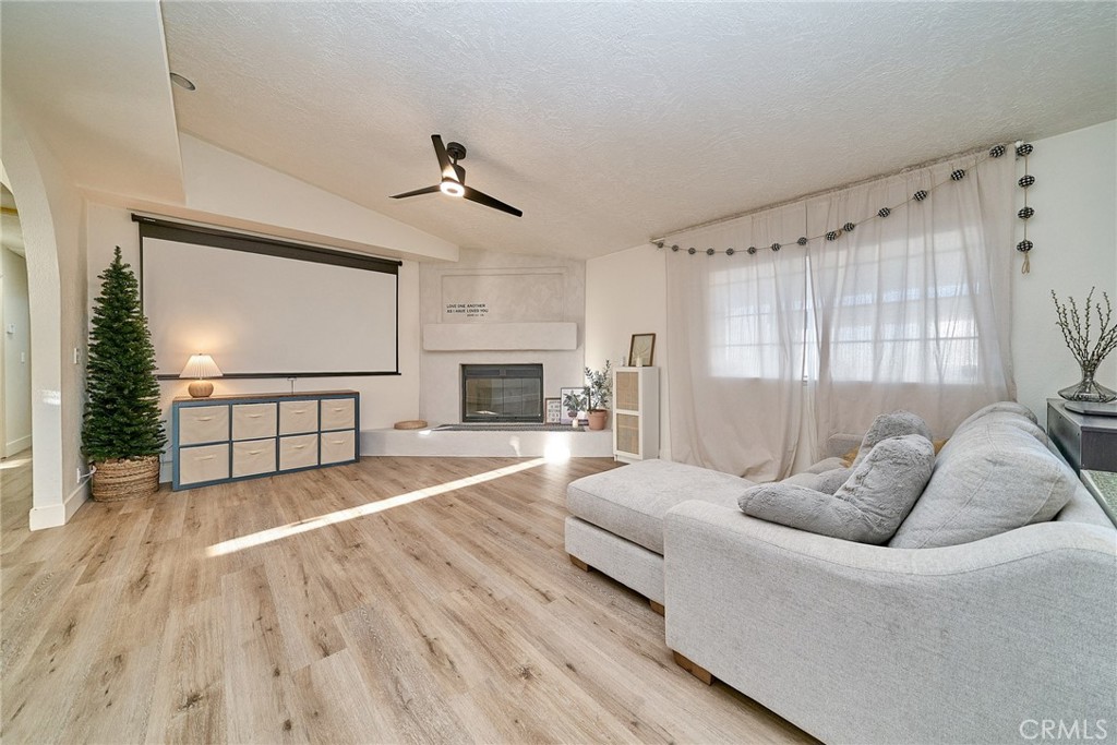 9783 Corton Street Phelan, CA 92371 - Photo 11 of 29 a living room with furniture and a fireplace