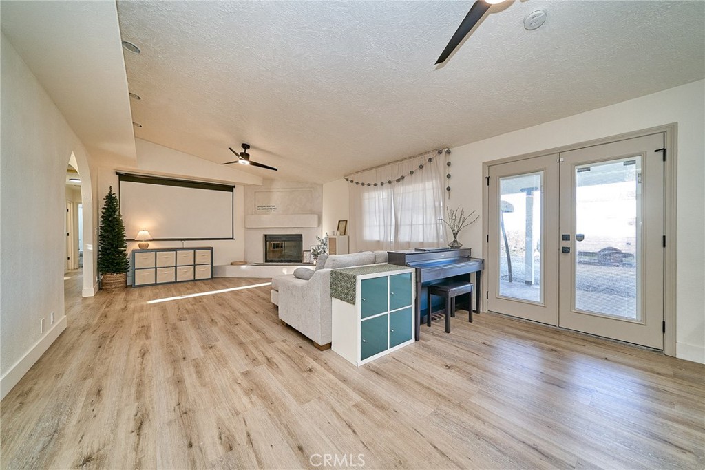 9783 Corton Street Phelan, CA 92371 - Photo 12 of 29 a large open kitchen with cabinets a counter top space a sink and a refrigerator