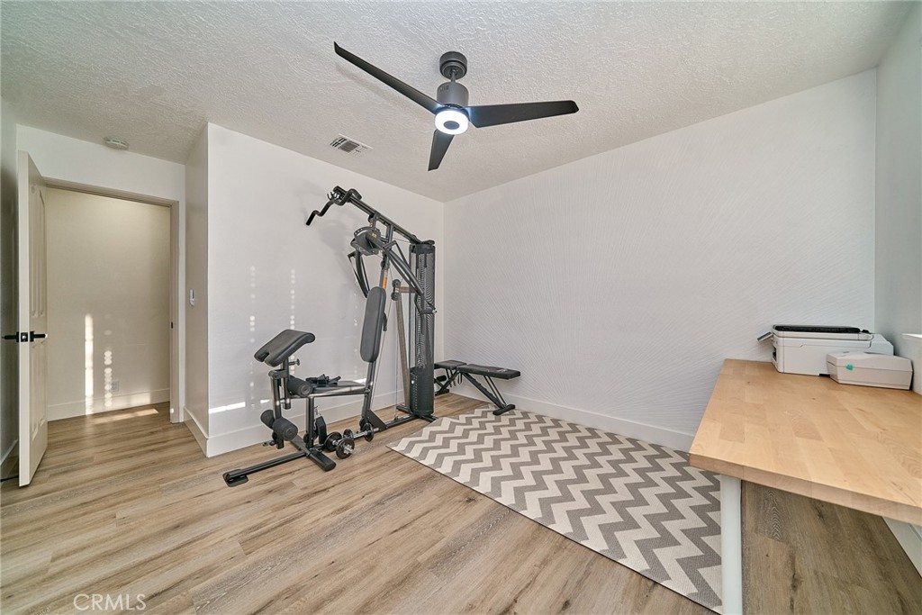 9783 Corton Street Phelan, CA 92371 - Photo 16 of 29 a view of workspace with wooden floor