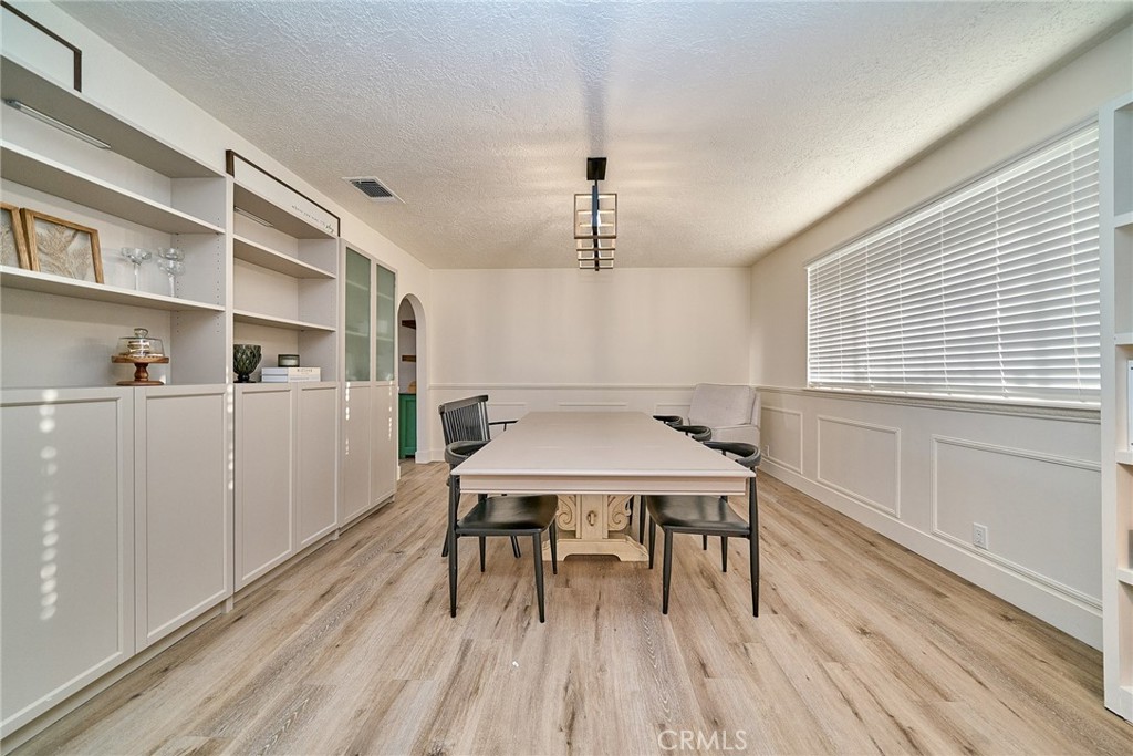 9783 Corton Street Phelan, CA 92371 - Photo 24 of 29 a view of a workspace with furniture and wooden floor