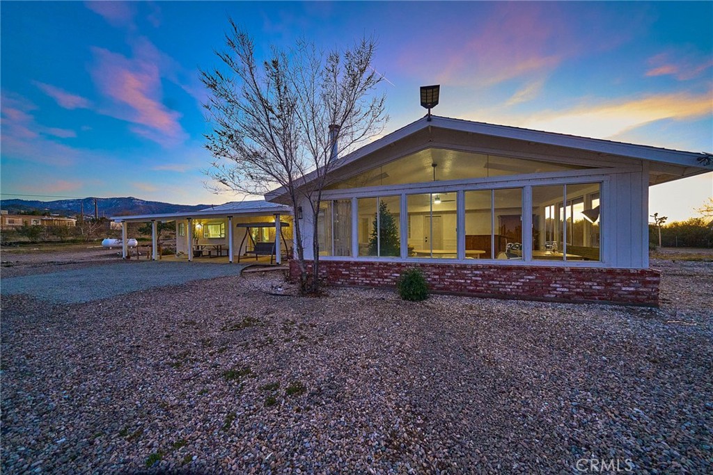 9783 Corton Street Phelan, CA 92371 - Photo 28 of 29 a front view of a house with garden