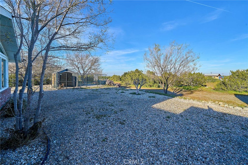 9783 Corton Street Phelan, CA 92371 - Photo 8 of 29 a view of outdoor space with deck and backyard
