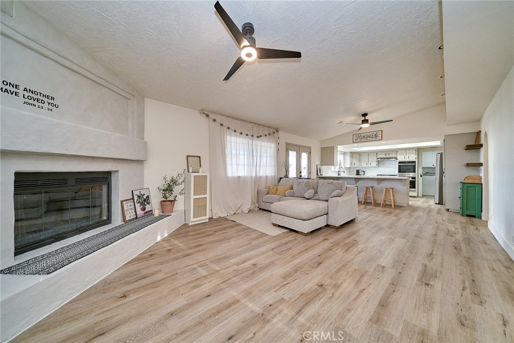 9783 Corton Street Phelan, CA 92371 - Photo 10 of 29 a living room with furniture and a fireplace