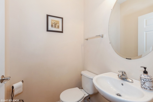 152 Orchards Pass Bartlett, IL 60103 - Photo 13 of 40 a bathroom with a toilet sink and mirror