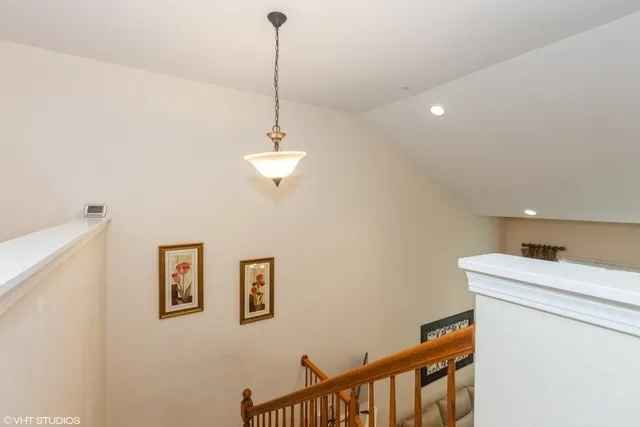 a view of a hallway with a washer and dryer