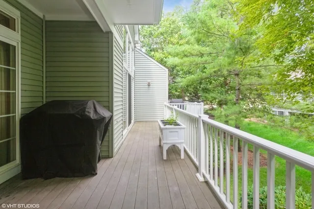 a view of a balcony with wooden floor