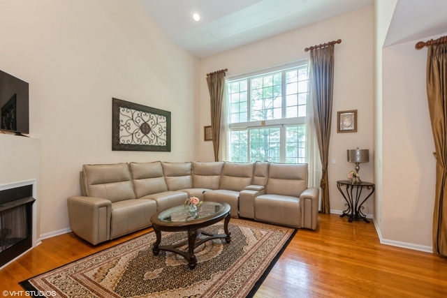 152 Orchards Pass Bartlett, IL 60103 - Photo 4 of 40 a living room with furniture and a rug