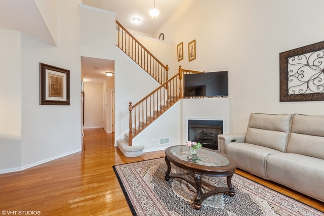152 Orchards Pass Bartlett, IL 60103 - Photo 6 of 40 a living room with furniture and a fireplace