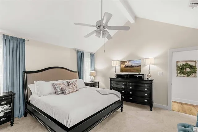 a bedroom with a bed and window