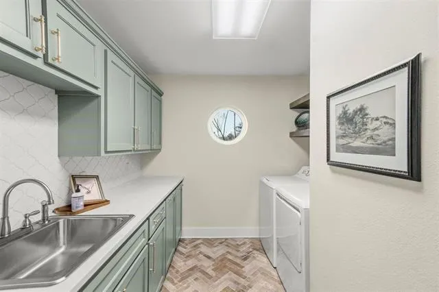a kitchen with stainless steel appliances granite countertop a sink and a microwave