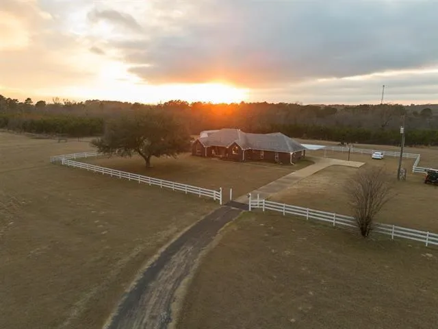 an aerial view of a houses with ocean view