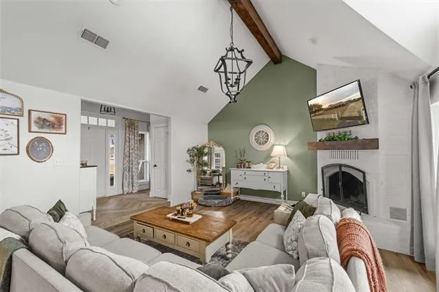 a living room with furniture and a fireplace