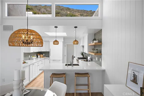 a room with a sink and a mirror