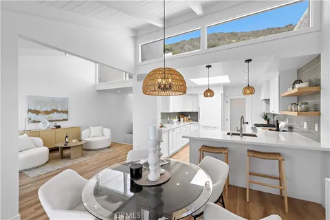 a very nice looking dining room with a table and chairs
