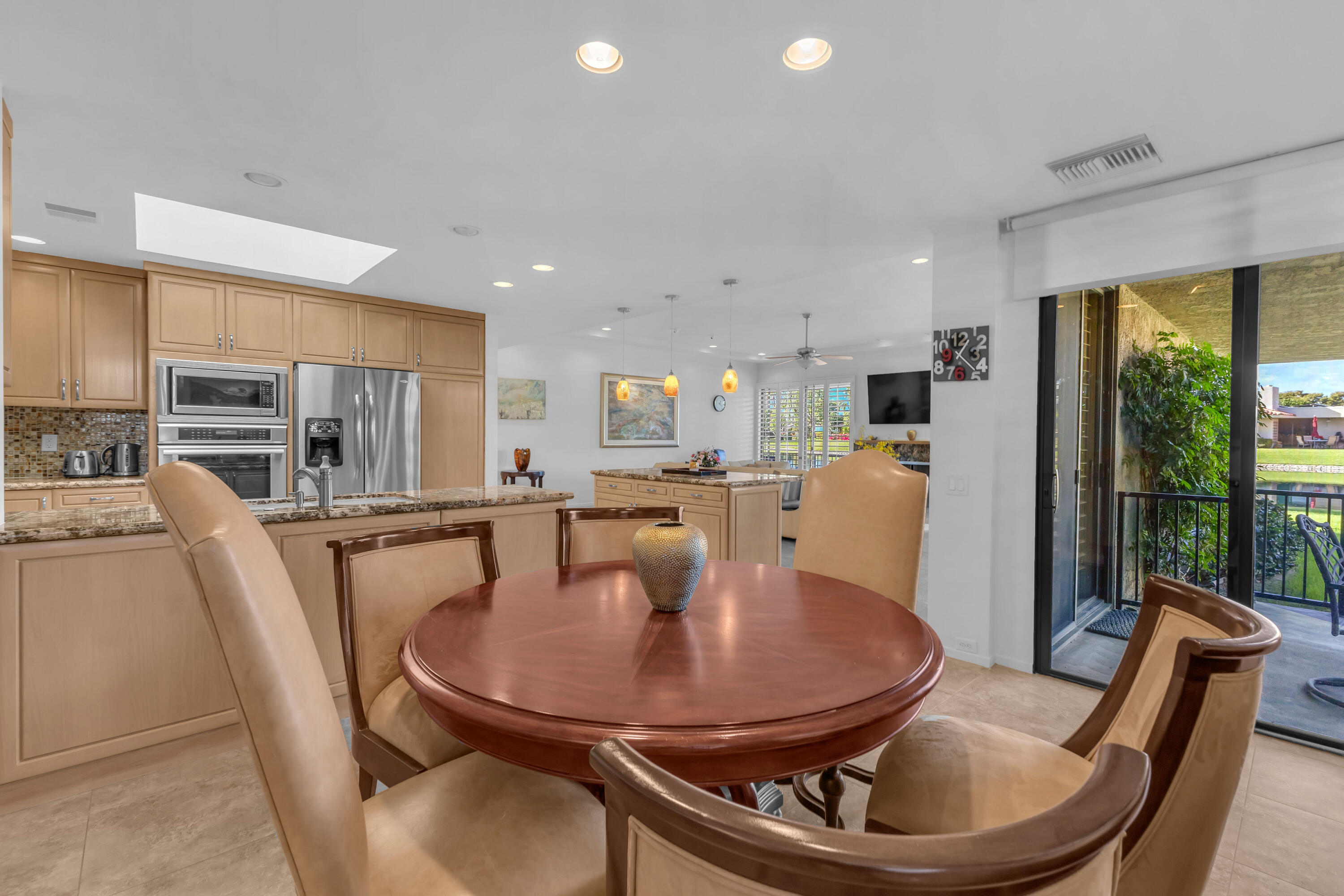 10 Colgate Drive Rancho Mirage, CA 92270 - Photo 19 of 49 a dining room with furniture a window and kitchen view