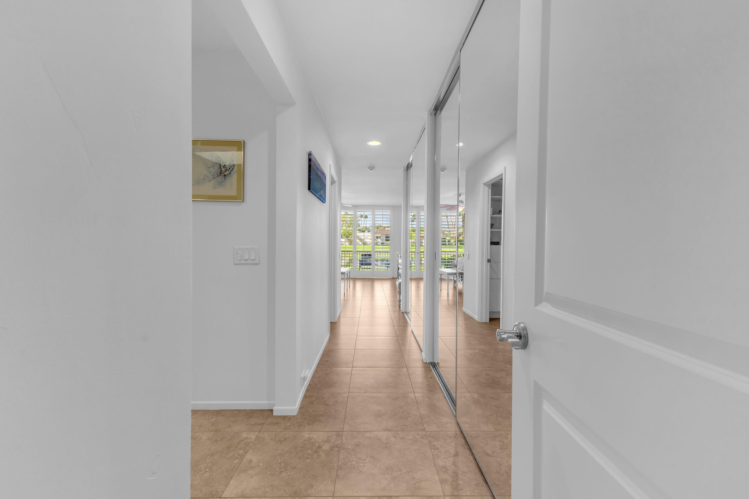10 Colgate Drive Rancho Mirage, CA 92270 - Photo 21 of 49 a view of a hallway with wooden floor