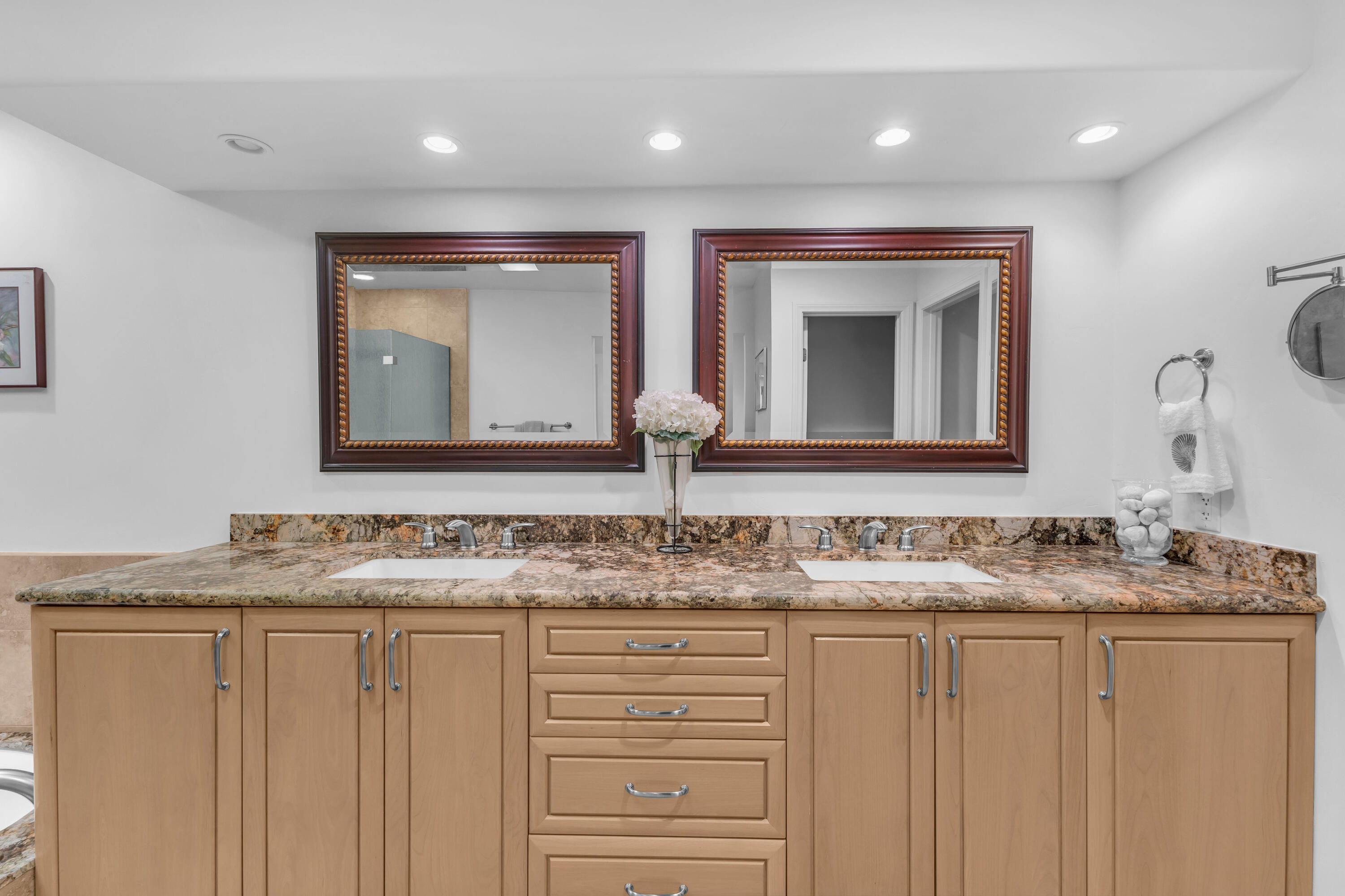 10 Colgate Drive Rancho Mirage, CA 92270 - Photo 25 of 49 a bathroom with a granite countertop sink and a mirror