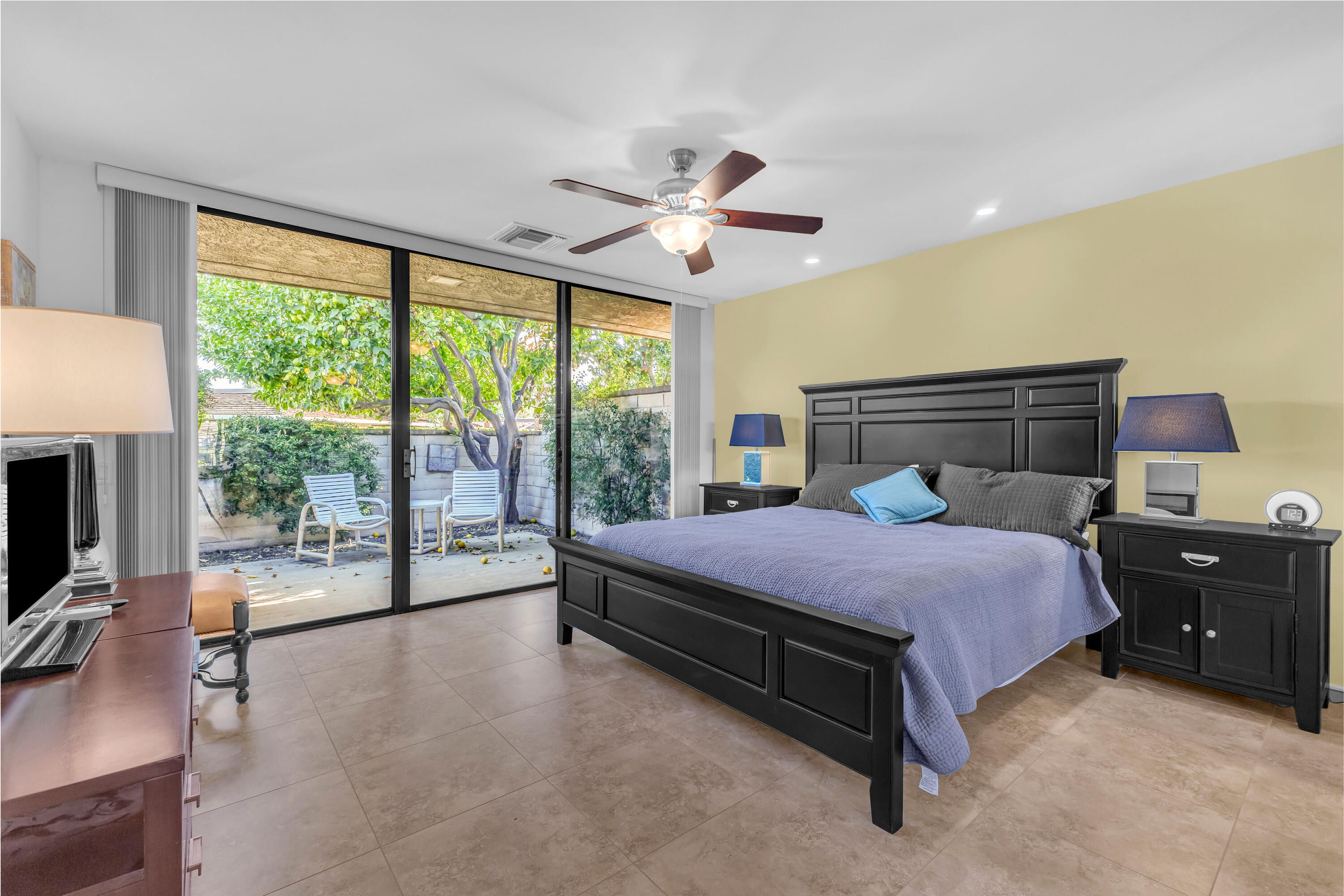 10 Colgate Drive Rancho Mirage, CA 92270 - Photo 30 of 49 a bedroom with a bed and large glass window