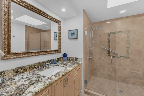 a view of a chairs and table in the backyard