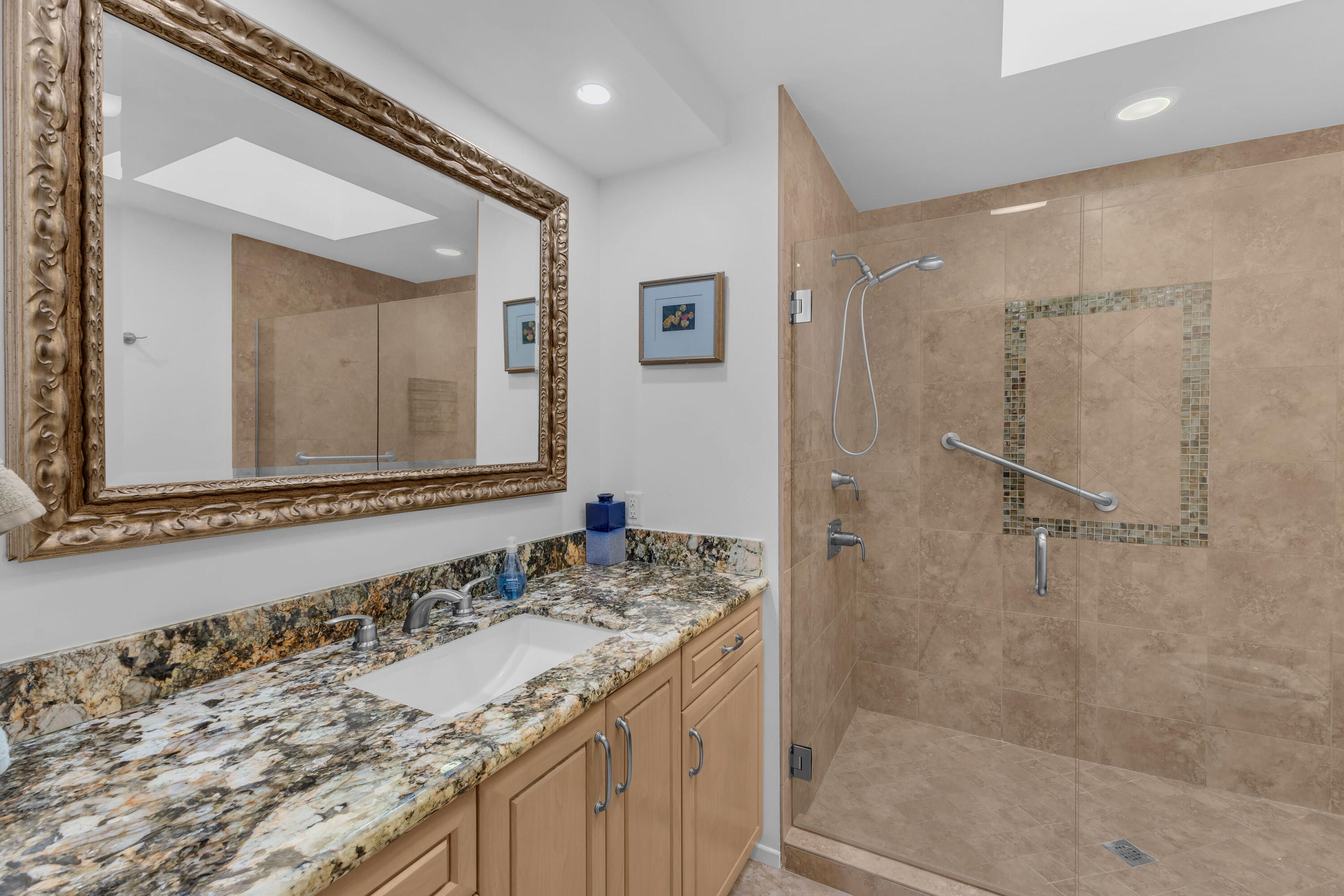 10 Colgate Drive Rancho Mirage, CA 92270 - Photo 32 of 49 a bathroom with a granite countertop sink a mirror and a shower