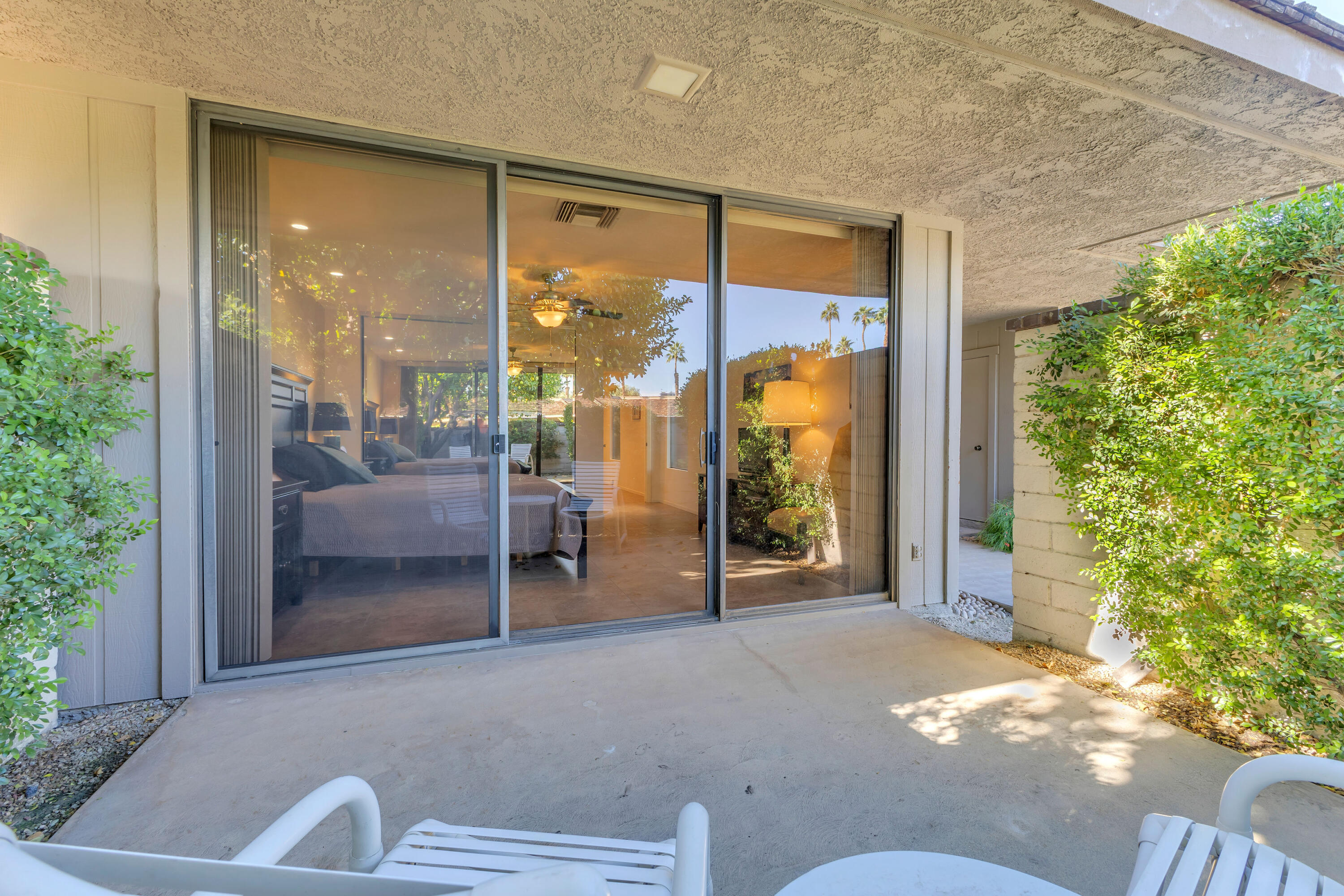 10 Colgate Drive Rancho Mirage, CA 92270 - Photo 34 of 49 a balcony with furniture and a potted plant