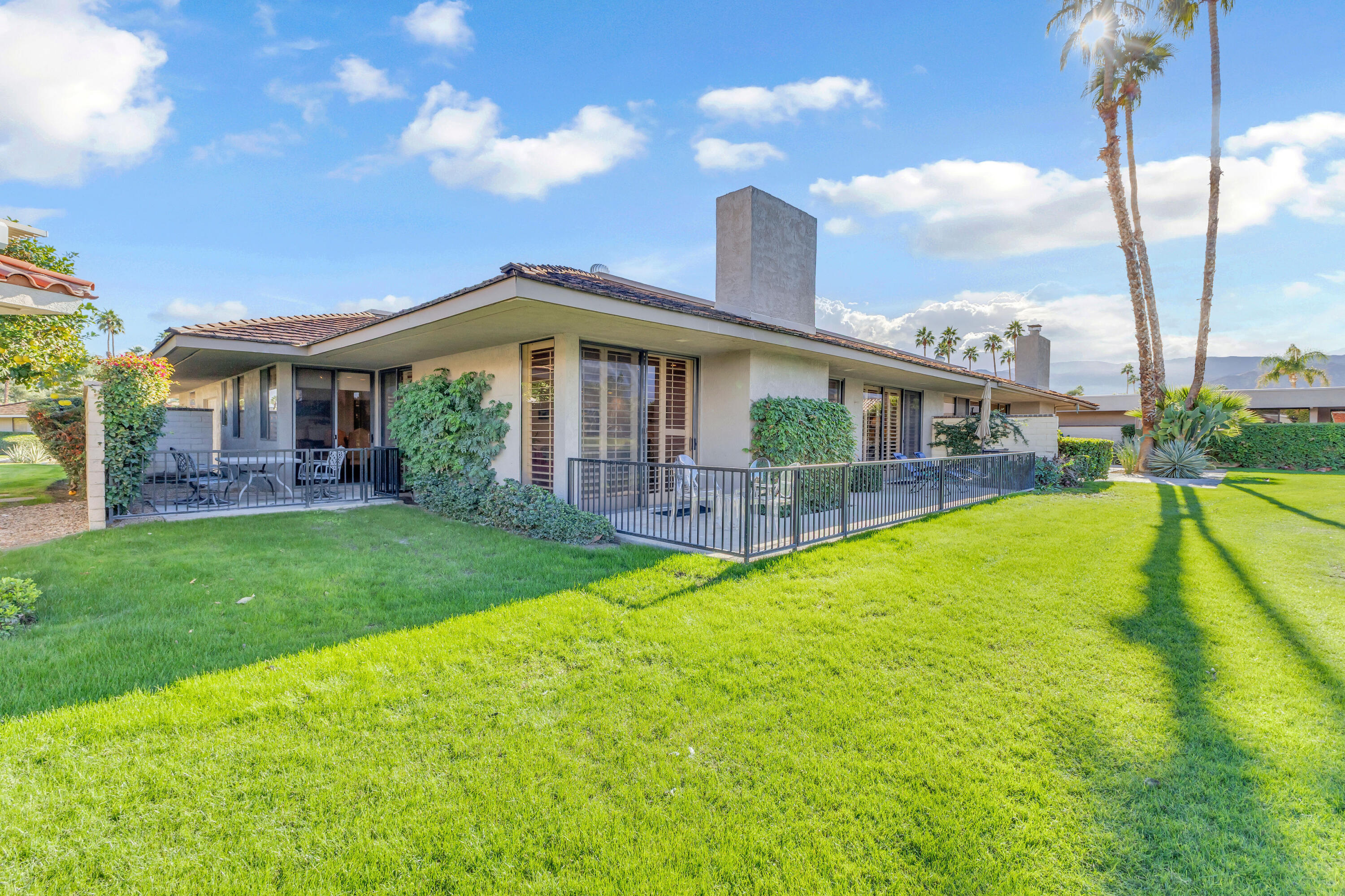 10 Colgate Drive Rancho Mirage, CA 92270 - Photo 40 of 49 a view of a house with a yard patio and swimming pool