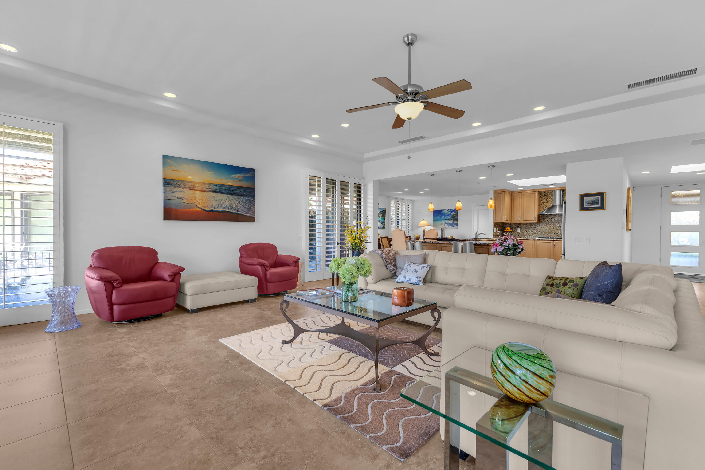 10 Colgate Drive Rancho Mirage, CA 92270 - Photo 10 of 49 a living room with furniture a window and a flat screen tv
