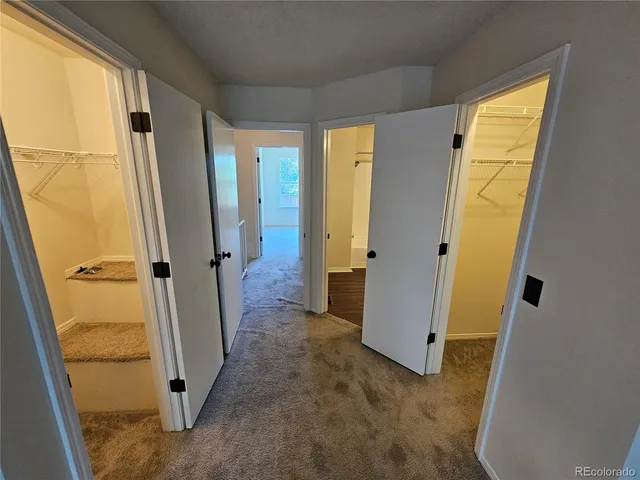 a view of a house with wooden floor and a door