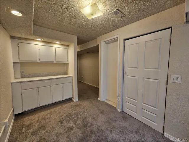 a bathroom with a shower and a sink