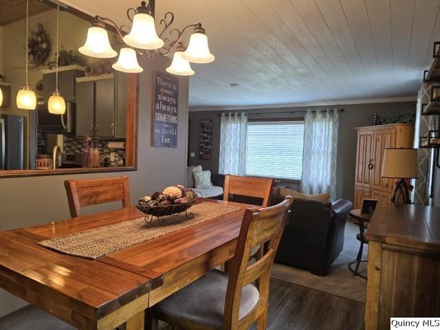 704 Orchard Lane Carthage, IL 62321 - Photo 5 of 36 a view of a dining room with furniture and chandelier