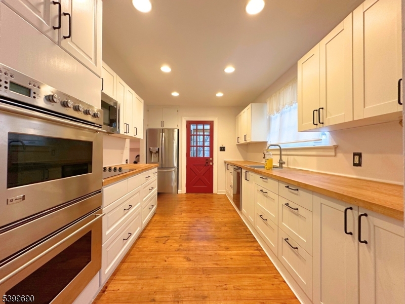 755 Preakness Avenue Wayne, NJ 07470 - Photo 11 of 35 a large kitchen with cabinets