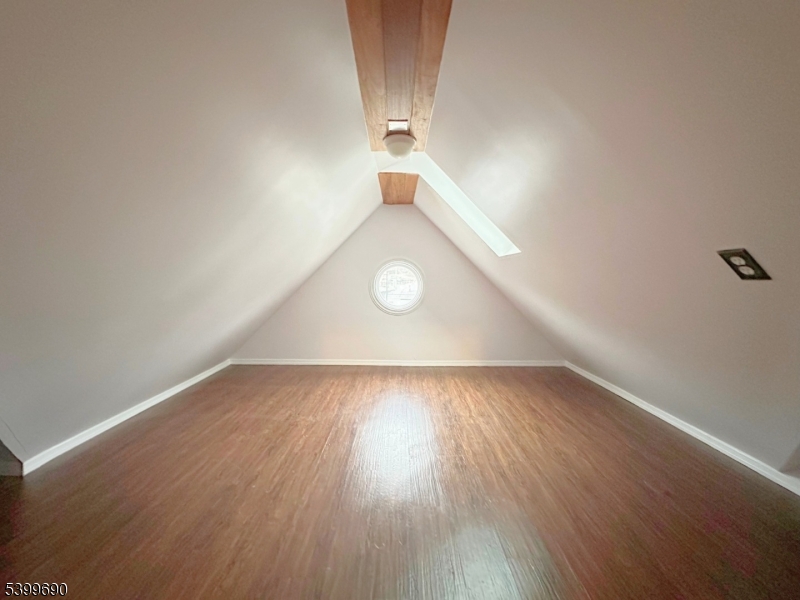 755 Preakness Avenue Wayne, NJ 07470 - Photo 25 of 35 an empty room with wooden floor and windows