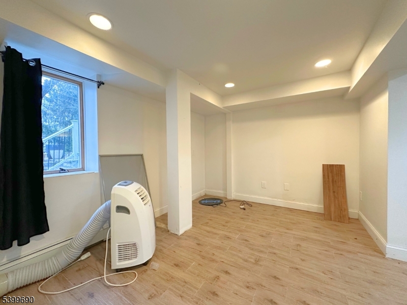 755 Preakness Avenue Wayne, NJ 07470 - Photo 31 of 35 a view of empty room with wooden floor