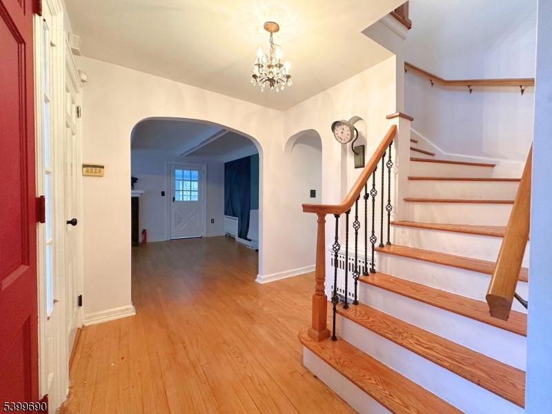 755 Preakness Avenue Wayne, NJ 07470 - Photo 5 of 35 a view of entryway with wooden floor and stairs