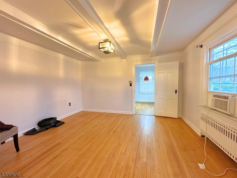 755 Preakness Avenue Wayne, NJ 07470 - Photo 9 of 35 a view of empty room with wooden floor and fan