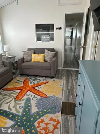 a living room with furniture and a rug