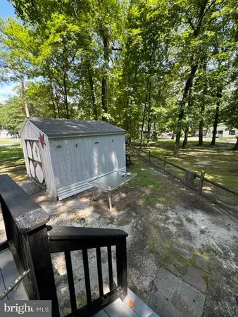 a view of a backyard with sitting area
