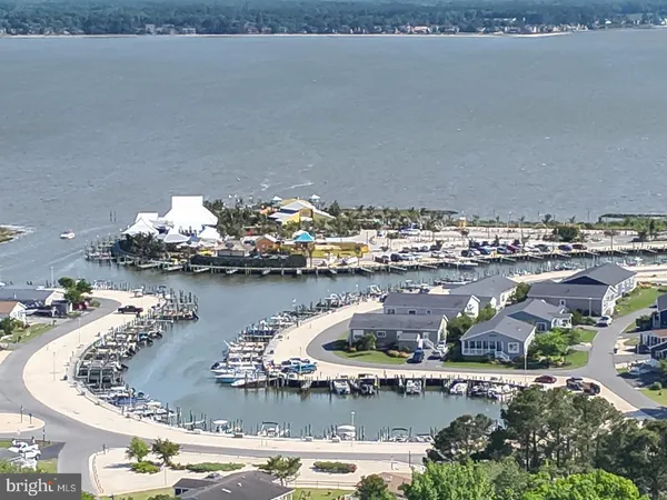 an aerial view of a house with a lake view