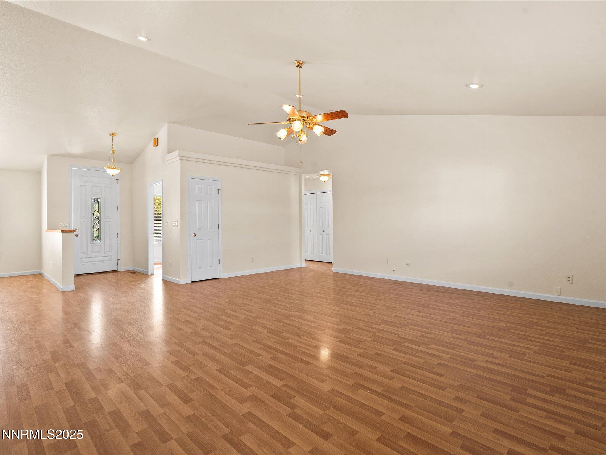 696 Sunrise Terrace Fallon, NV 89406 - Photo 14 of 65 a view of a room with wooden floor and a ceiling fan