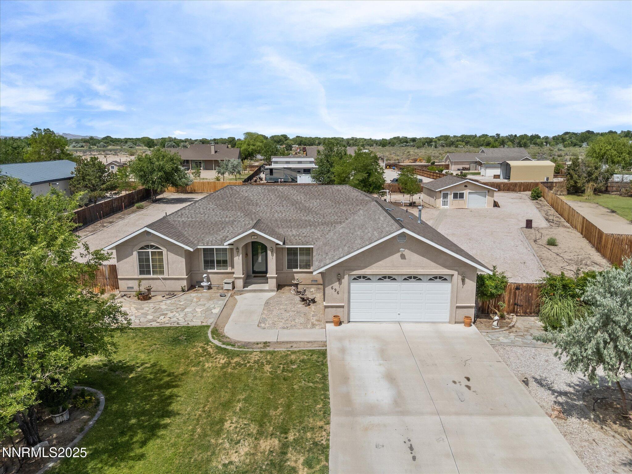 696 Sunrise Terrace Fallon, NV 89406 - Photo 53 of 65 an aerial view of residential houses with outdoor space and trees