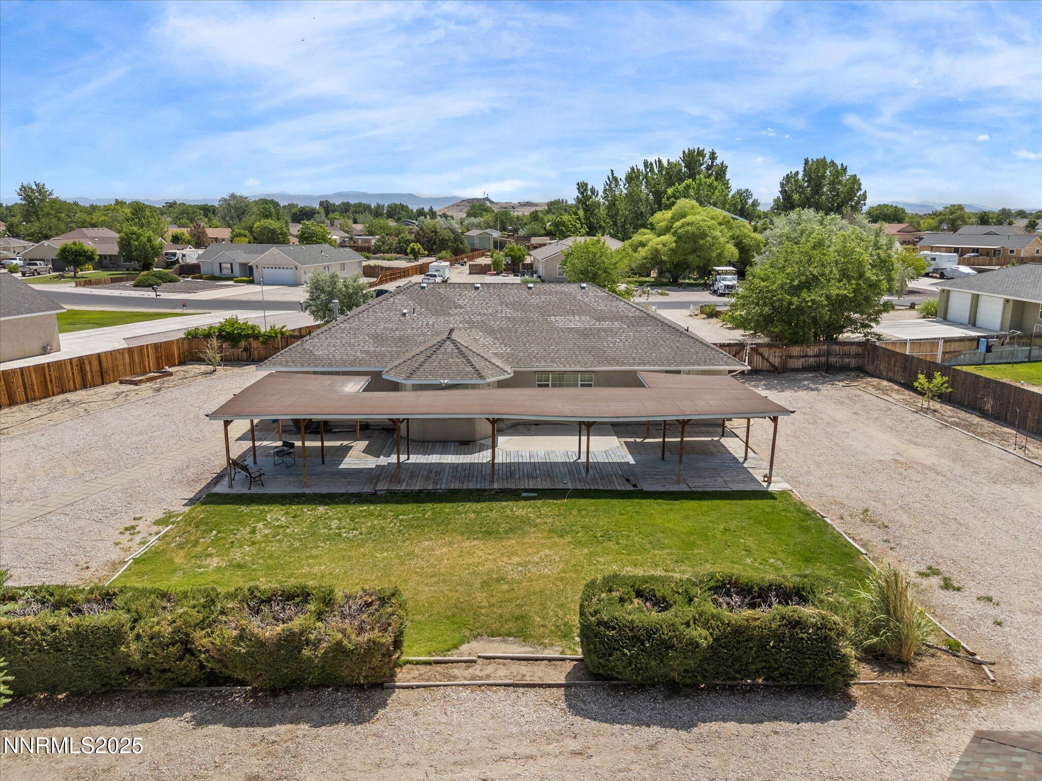 696 Sunrise Terrace Fallon, NV 89406 - Photo 55 of 65 a swimming pool with lawn chairs and large trees